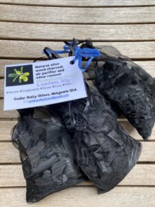 4 Organza bags of charcoal tied together with a label