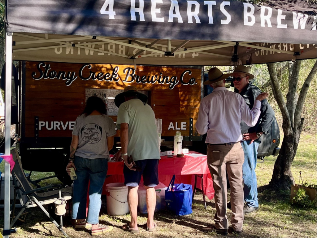 People shopping at beer truck